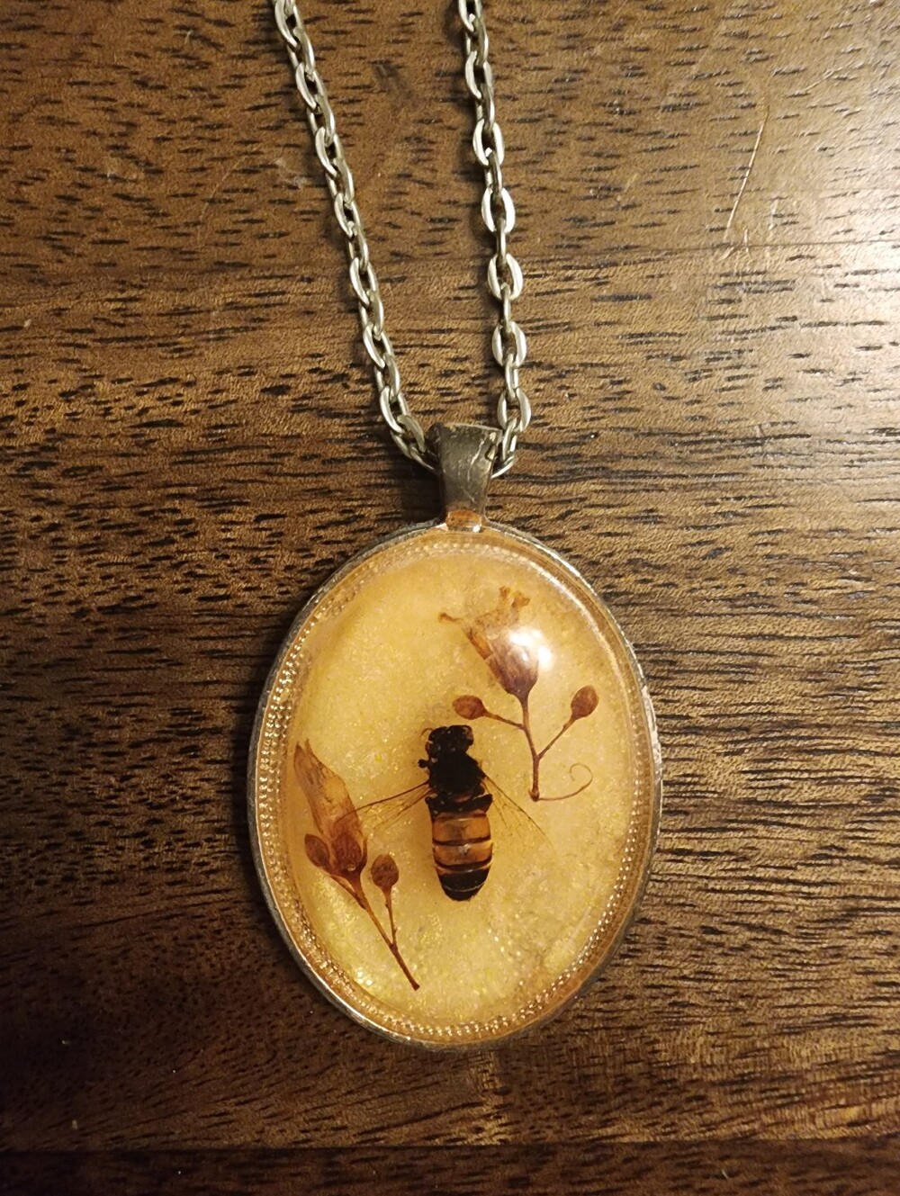 Bee Encased Resin Oval Pendant Necklace in Golden Amber